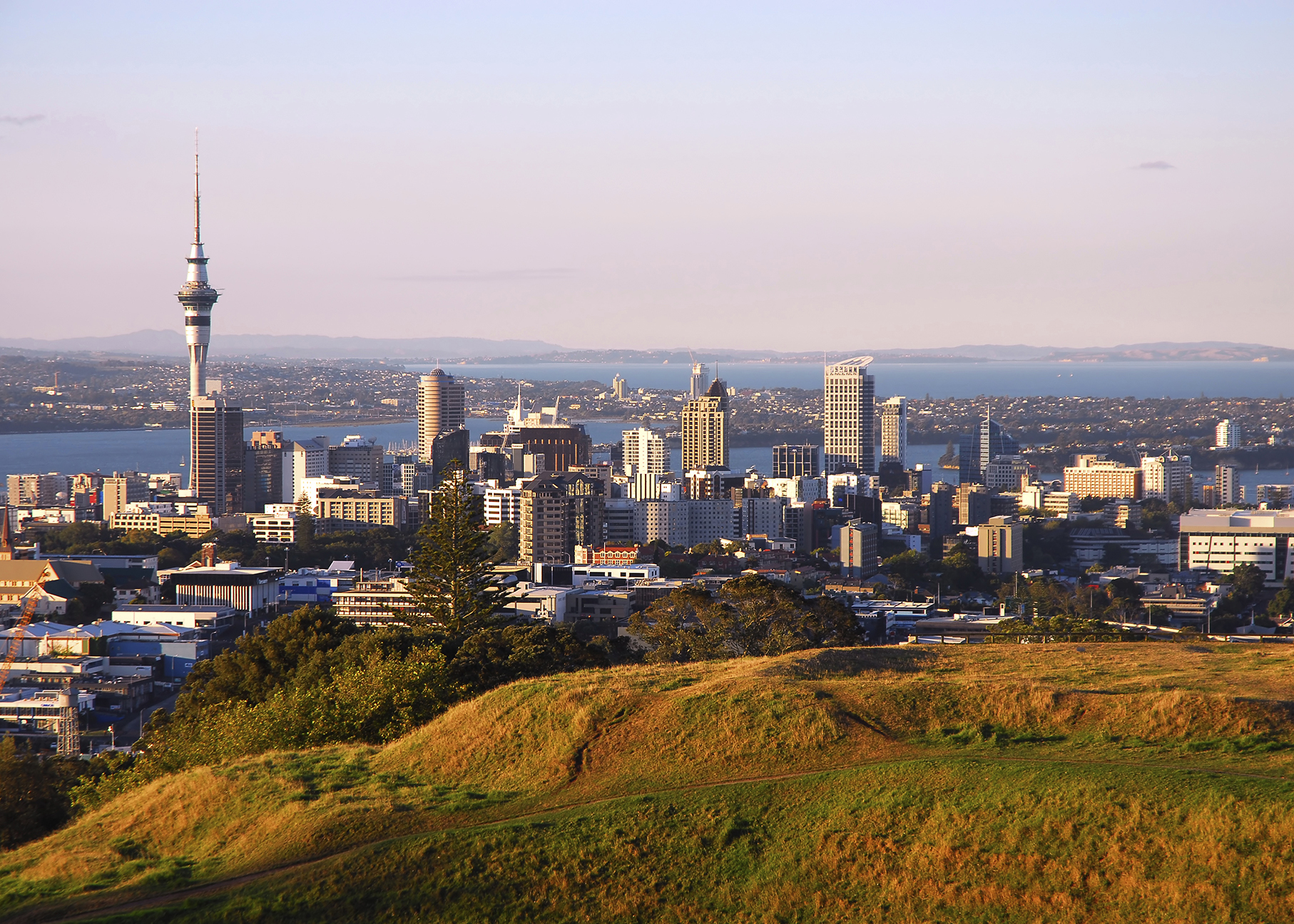 stunning hilltop panorama of auckland city as seen from local landmark, the dormant volcano mt eden.