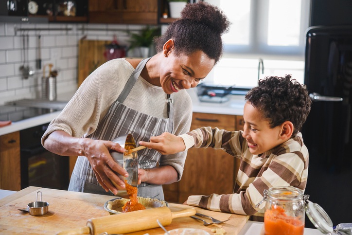 Mother cooking with her son
