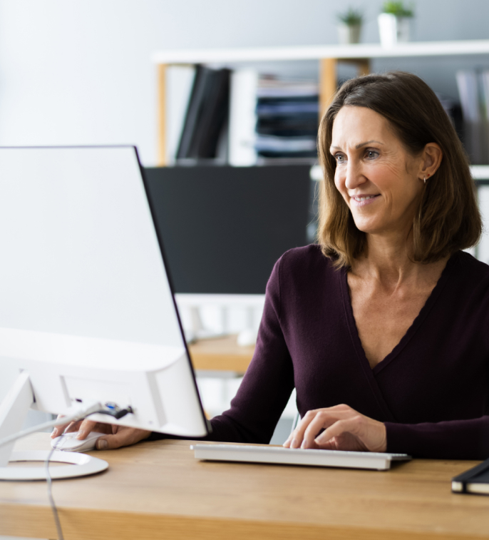 Woman at computer smiling