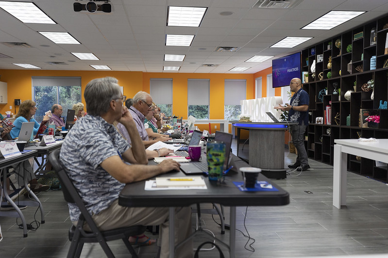 how-can-a-host-travel-agency-help-you Travel advisors attending an information session provided by their host travel agency, Travel Planners International